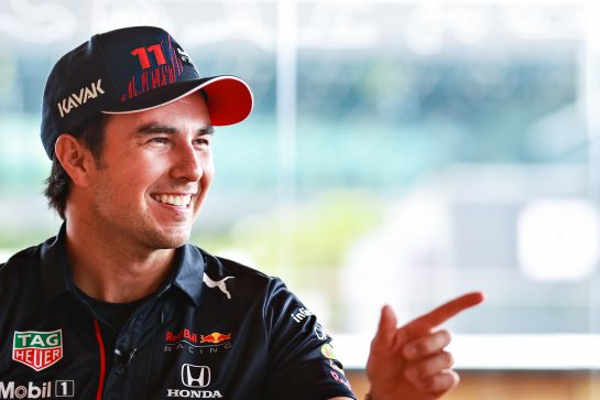 SPIELBERG, AUSTRIA - JULY 01: Sergio Perez of Mexico and Red Bull Racing talks in the Paddock during previews ahead of the F1 Grand Prix of Austria at Red Bull Ring on July 01, 2021 in Spielberg, Austria. (Photo by Mark Thompson/Getty Images) // Getty Images / Red Bull Content Pool  // SI202107010155 // Usage for editorial use only //