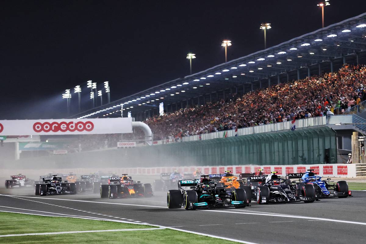 Lewis Hamilton (GBR) Mercedes AMG F1 W12 leads Pierre Gasly (FRA) AlphaTauri AT02 and Fernando Alonso (ESP) Alpine F1 Team A521 at the start of the race. 21.11.2021. Formula 1 World Championship, Rd 20, Qatar Grand Prix, Doha