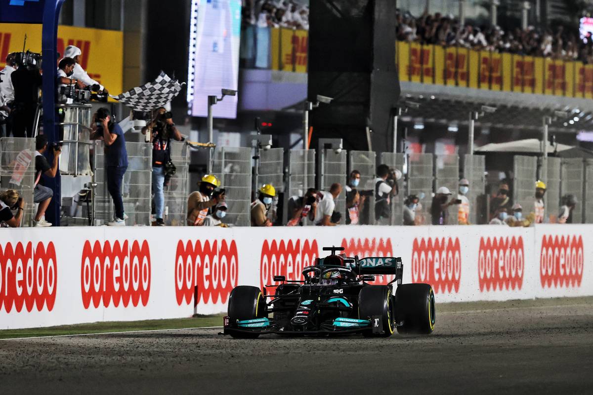 Race winner Lewis Hamilton (GBR) Mercedes AMG F1 W12 takes the chequered flag at the end of the race. 21.11.2021. Formula 1 World Championship, Rd 20, Qatar Grand Prix, Doha