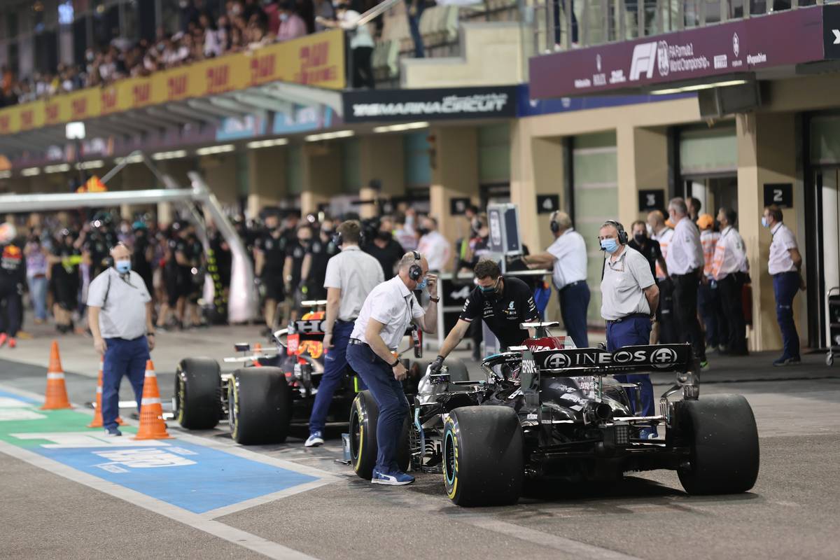 Max Verstappen (NLD) Red Bull Racing RB16B and Lewis Hamilton (GBR) Mercedes AMG F1 W12 both called in by the FIA for checks. 10.12.2021. Formula 1 World Championship, Rd 22, Abu Dhabi Grand Prix, Yas Marina