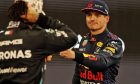 Max Verstappen (NLD) Red Bull Racing celebrates his pole position with second placed Lewis Hamilton (GBR) Mercedes AMG F1 in qualifying parc ferme. 11.12.2021. Formula 1 World Championship, Rd 22, Abu Dhabi Grand Prix, Yas Marina