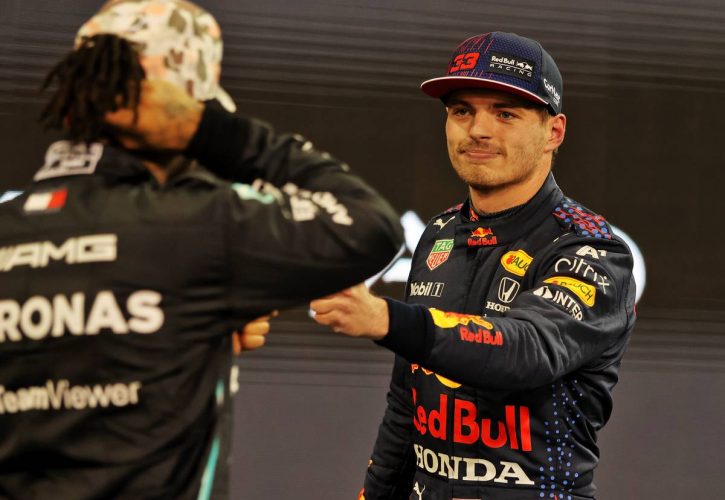 Max Verstappen (NLD) Red Bull Racing celebrates his pole position with second placed Lewis Hamilton (GBR) Mercedes AMG F1 in qualifying parc ferme. 11.12.2021. Formula 1 World Championship, Rd 22, Abu Dhabi Grand Prix, Yas Marina