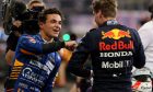 Lando Norris (GBR) McLaren MCL35M with Pole postition for Max Verstappen (NLD) Red Bull Racing. 11.12.2021. Formula 1 World Championship, Rd 22, Abu Dhabi Grand Prix, Yas Marina