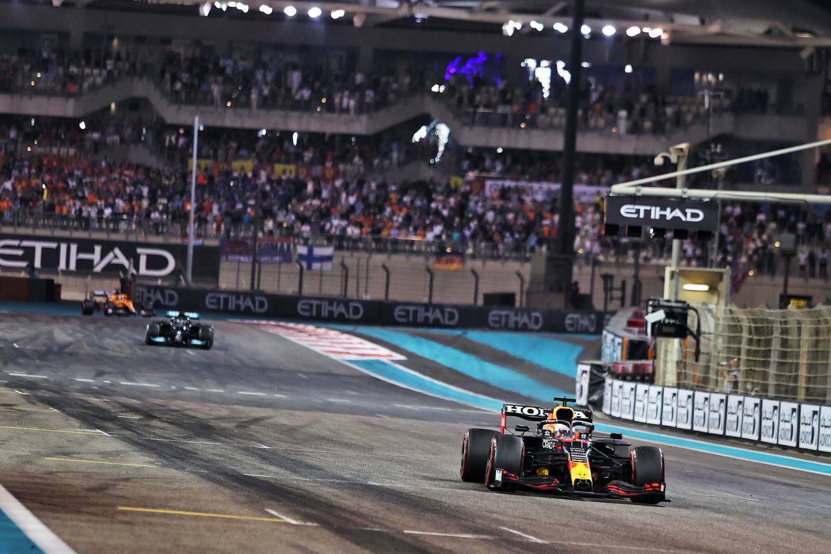 Race winner and World Champion Max Verstappen (NLD) Red Bull Racing RB16B wins the race ahead of second placed Lewis Hamilton (GBR) Mercedes AMG F1 W12. 12.12.2021. Formula 1 World Championship, Rd 22, Abu Dhabi Grand Prix, Yas Marina