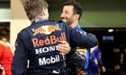1st place and new World Champion, Max Verstappen (NLD) Red Bull Racing RB16B and Daniel Ricciardo (AUS) McLaren MCL35M. 12.12.2021. Formula 1 World Championship, Rd 22, Abu Dhabi Grand Prix, Yas Marina
