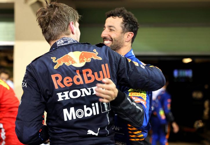 1st place and new World Champion, Max Verstappen (NLD) Red Bull Racing RB16B and Daniel Ricciardo (AUS) McLaren MCL35M. 12.12.2021. Formula 1 World Championship, Rd 22, Abu Dhabi Grand Prix, Yas Marina