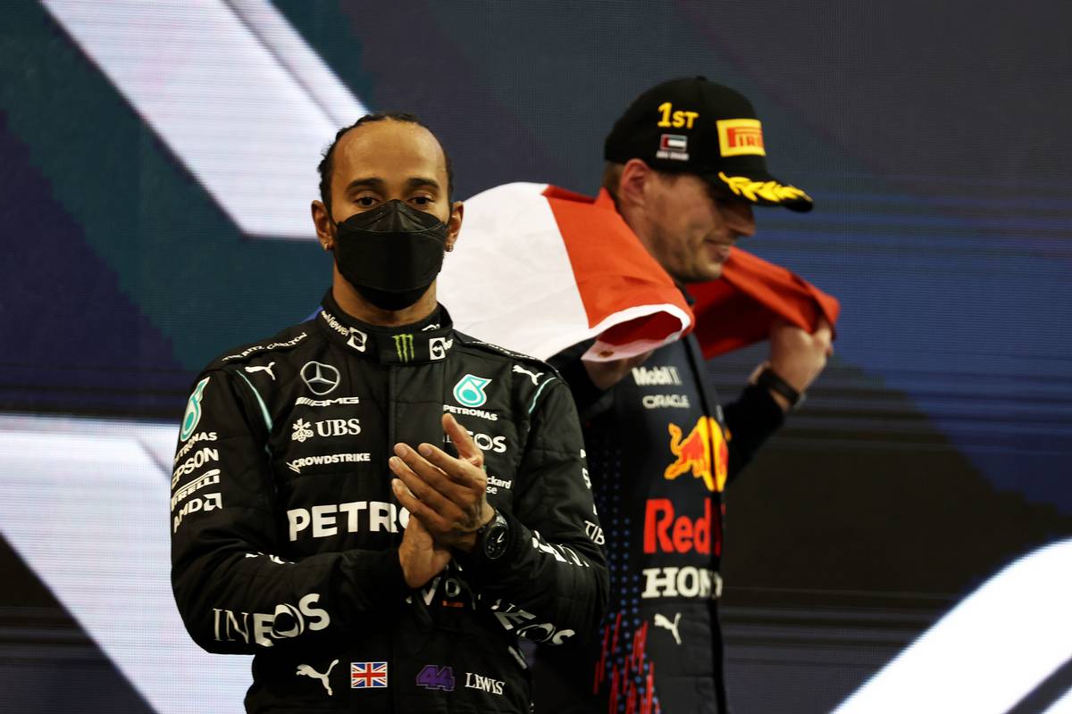 Lewis Hamilton (GBR) Mercedes AMG F1 W12 with 1st place and new World Champion, Max Verstappen (NLD) Red Bull Racing RB16B. 12.12.2021. Formula 1 World Championship, Rd 22, Abu Dhabi Grand Prix, Yas Marina