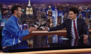 Danny Ric enjoys a shoey on The Daily Show