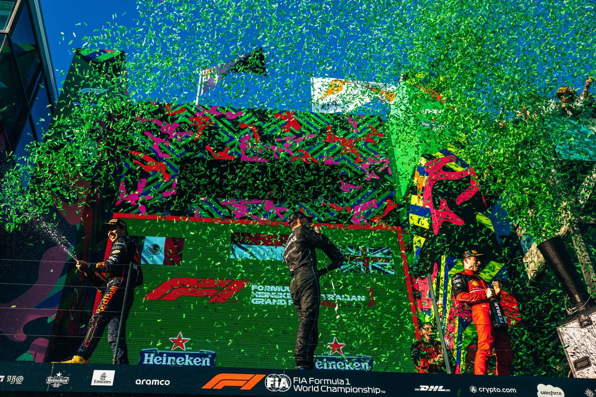 second placed Sergio Perez (MEX) Red Bull Racing; third placed George Russell (GBR) Mercedes AMG F1, and race winner Charles Leclerc (MON) Ferrari, celebrate with the champagne on the podium. 10.04.2022. Formula 1 World Championship, Rd 3, Australian Grand Prix, Albert Park, Melbourne