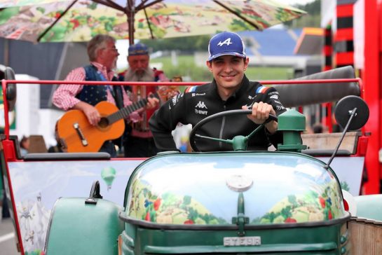 Paddock atmosphere - Esteban Ocon (FRA) Alpine F1 Team drives the circuit tractor train.
07.07.2022. Formula 1 World Championship, Rd 11, Austrian Grand Prix, Spielberg, Austria, Preparation Day.
- www.xpbimages.com, EMail: requests@xpbimages.com © Copyright: Coates / XPB Images