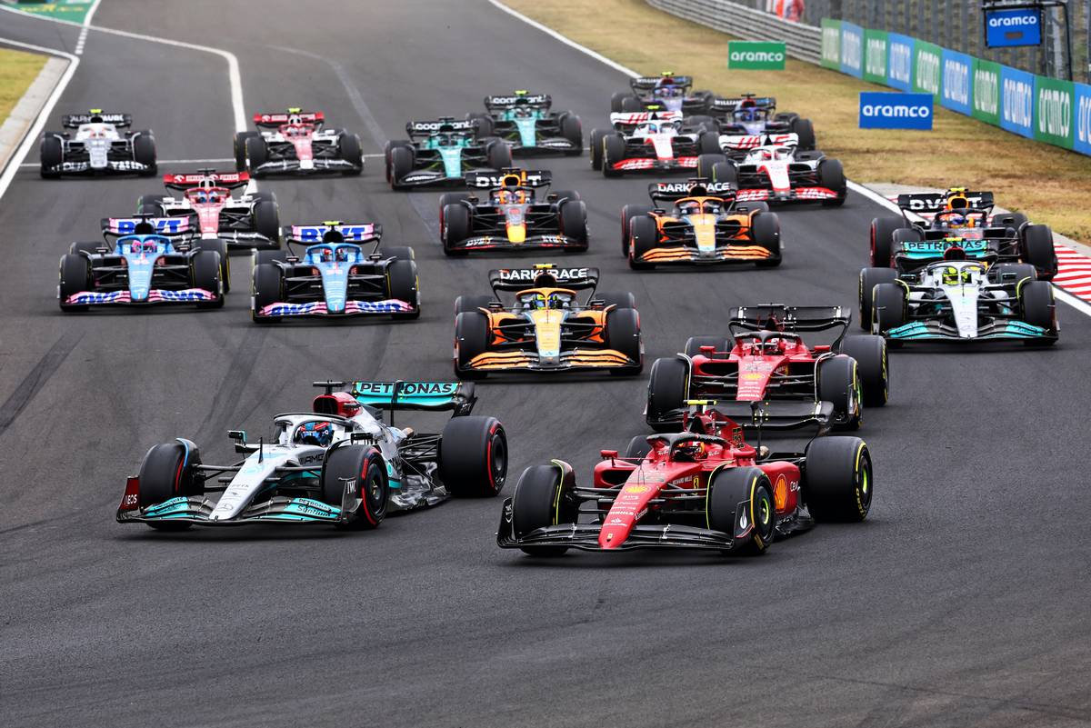 George Russell (GBR) Mercedes AMG F1 W13 leads Carlos Sainz Jr (ESP) Ferrari F1-75 at the start of the race. 31.07.2022. Formula 1 World Championship, Rd 13, Hungarian Grand Prix, Budapest, Hungary, Race