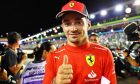 Charles Leclerc (MON) Ferrari celebrates his pole position in qualifying parc ferme. 01.10.2022. Formula 1 World Championship, Rd 17, Singapore Grand Prix, Marina Bay Street Circuit, Singapore, Qualifying