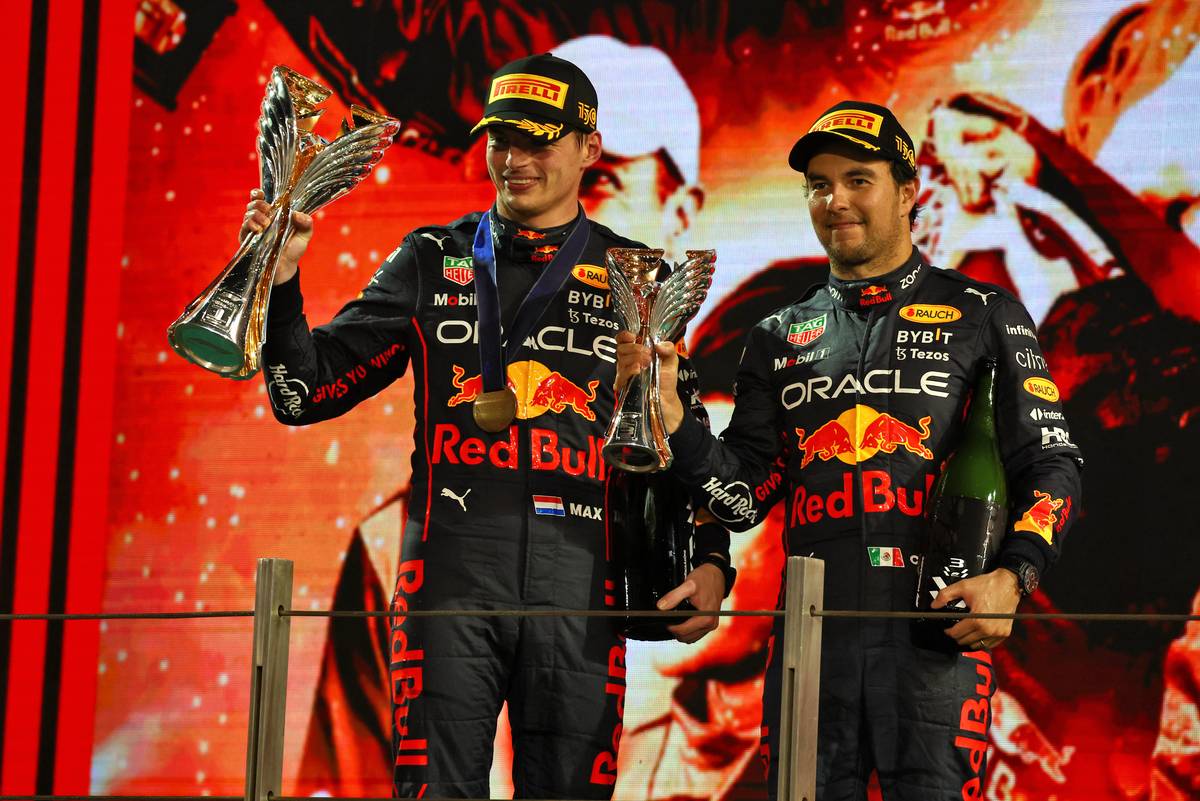 Race winner Max Verstappen (NLD) Red Bull Racing and third placed team mate Sergio Perez (MEX) Red Bull Racing celebrate on the podium. 20.11.2022. Formula 1 World Championship, Rd 22, Abu Dhabi Grand Prix, Yas Marina Circuit, Abu Dhabi, Race
