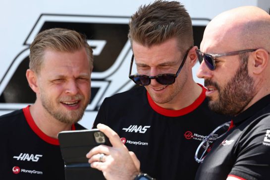 (L to R): Kevin Magnussen (DEN) Haas F1 Team with Nico Hulkenberg (GER) Haas F1 Team and Stuart Morrison (GBR) Haas F1 Team Head of Communications.
02.03.2023. Formula 1 World Championship, Rd 1, Bahrain Grand Prix, Sakhir, Bahrain, Preparation Day.
 - www.xpbimages.com, EMail: requests@xpbimages.com © Copyright: Coates / XPB Images