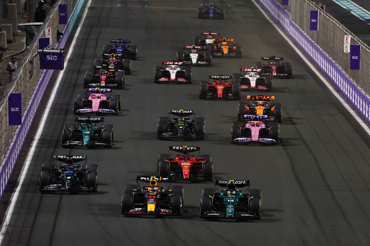 Sergio Perez (MEX) Red Bull Racing RB19 and Fernando Alonso (ESP) Aston Martin F1 Team AMR23 at the start of the race. 19.03.2023. Formula 1 World Championship, Rd 2, Saudi Arabian Grand Prix, Jeddah, Saudi Arabia, Race Day. - www.xpbimages.com, EMail: requests@xpbimages.com © Copyright: Coates / XPB Images