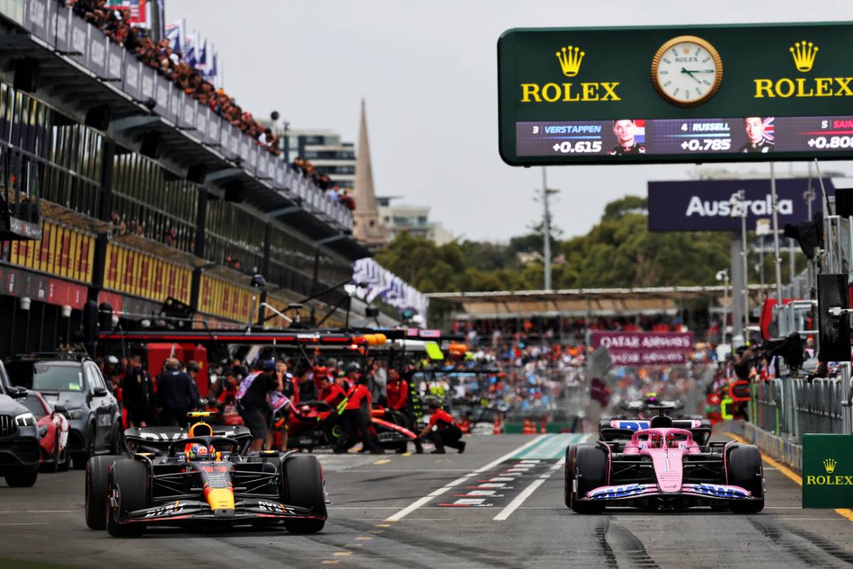 Sergio Perez (MEX) Red Bull Racing RB19 and Esteban Ocon (FRA) Alpine F1 Team leave the pits. 31.03.2023. Formula 1 World Championship, Rd 3, Australian Grand Prix, Albert Park, Melbourne, Australia, Practice Day. - www.xpbimages.com, EMail: requests@xpbimages.com © Copyright: Bearne / XPB Images