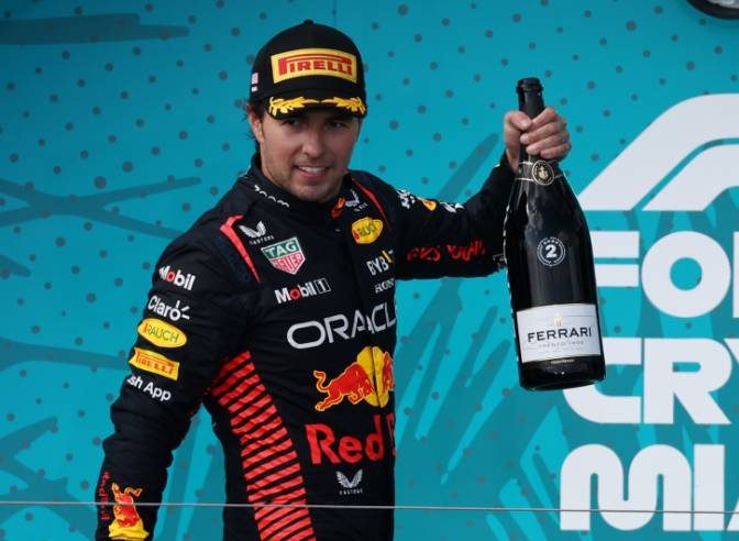 Sergio Perez (MEX) Red Bull Racing celebrates his second position on the podium. 07.05.2023. Formula 1 World Championship, Rd 5, Miami Grand Prix, Miami, Florida, USA, Race Day. - www.xpbimages.com, EMail: requests@xpbimages.com © Copyright: Moy / XPB Images