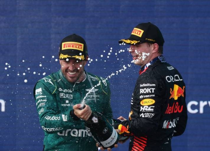 Fernando Alonso (ESP) Aston Martin F1 Team celebrates his third position on the podium with race winner Max Verstappen (NLD) Red Bull Racing. 07.05.2023. Formula 1 World Championship, Rd 5, Miami Grand Prix, Miami, Florida, USA, Race Day. - www.xpbimages.com, EMail: requests@xpbimages.com © Copyright: Moy / XPB Images