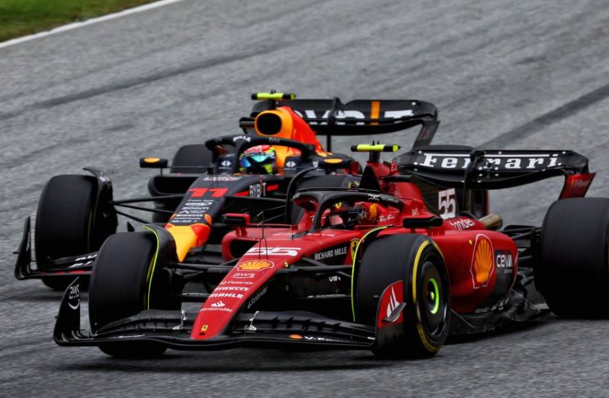 Carlos Sainz Jr (ESP) Ferrari SF-23 and Sergio Perez (MEX) Red Bull Racing RB19 battle for position. 02.07.2023. Formula 1 World Championship, Rd 10, Austrian Grand Prix, Spielberg, Austria, Race Day. - www.xpbimages.com, EMail: requests@xpbimages.com © Copyright: Coates / XPB Images