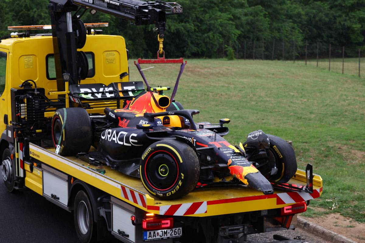 The damaged Red Bull Racing RB19 of Sergio Perez (MEX) is recovered back to the pits on the back of a truck. 21.07.2023. Formula 1 World Championship, Rd 12, Hungarian Grand Prix, Budapest, Hungary, Practice Day. - www.xpbimages.com, EMail: requests@xpbimages.com © Copyright: Coates / XPB Images