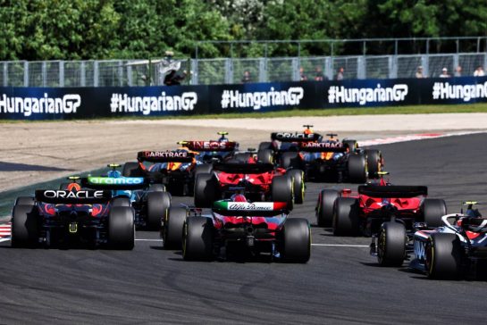 Sergio Perez (MEX) Red Bull Racing RB19 and Valtteri Bottas (FIN) Alfa Romeo F1 Team C43 at the start of the race.
23.07.2023. Formula 1 World Championship, Rd 12, Hungarian Grand Prix, Budapest, Hungary, Race Day.
- www.xpbimages.com, EMail: requests@xpbimages.com © Copyright: Charniaux / XPB Images