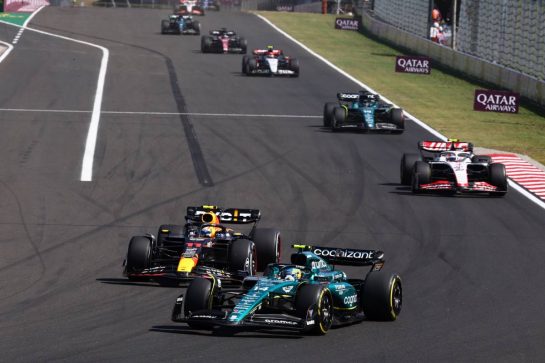 Fernando Alonso (ESP) Aston Martin F1 Team AMR23 and Sergio Perez (MEX) Red Bull Racing RB19 battle for position.
23.07.2023. Formula 1 World Championship, Rd 12, Hungarian Grand Prix, Budapest, Hungary, Race Day.
- www.xpbimages.com, EMail: requests@xpbimages.com © Copyright: Charniaux / XPB Images