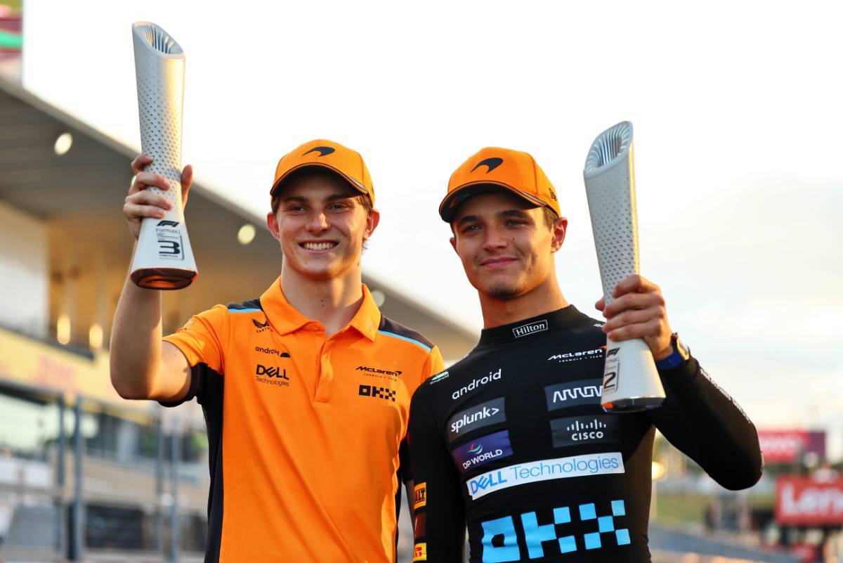(L to R): Oscar Piastri (AUS) McLaren celebrates his third position second placed team mate Lando Norris (GBR) McLaren. 24.09.2023. Formula 1 World Championship, Rd 17, Japanese Grand Prix, Suzuka, Japan, Race Day. - www.xpbimages.com, EMail: requests@xpbimages.com © Copyright: Batchelor / XPB Images
