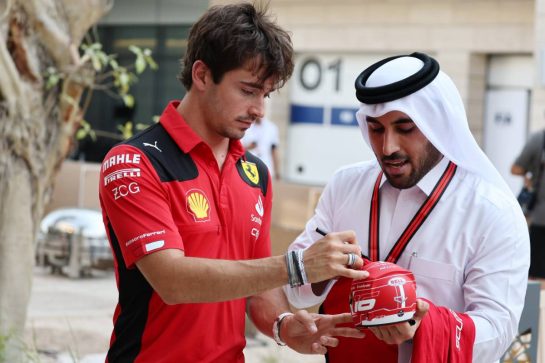 Charles Leclerc (MON) Ferrari with a fan.
05.10.2023. Formula 1 World Championship, Rd 18, Qatar Grand Prix, Doha, Qatar, Preparation Day.
- www.xpbimages.com, EMail: requests@xpbimages.com © Copyright: Moy / XPB Images