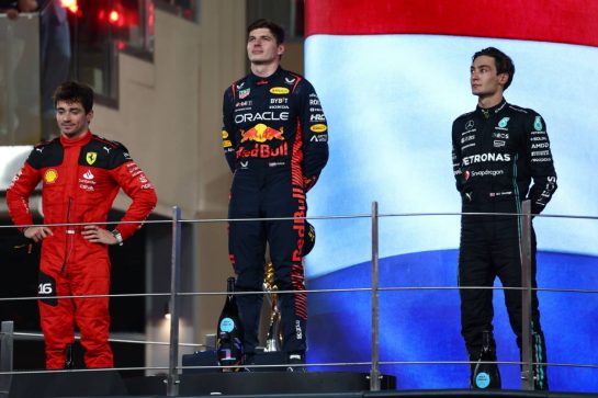 The podium (L to R): Charles Leclerc (MON) Ferrari, second; Max Verstappen (NLD) Red Bull Racing, race winner; George Russell (GBR) Mercedes AMG F1, third.
26.11.2023. Formula 1 World Championship, Rd 23, Abu Dhabi Grand Prix, Yas Marina Circuit, Abu Dhabi, Race Day.
 - www.xpbimages.com, EMail: requests@xpbimages.com © Copyright: Coates / XPB Images