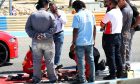 Circuit workers repair a damaged drain cover at turn 11. 22.02.2024. Formula 1 Testing, Sakhir, Bahrain, Day Two. - www.xpbimages.com, EMail: requests@xpbimages.com © Copyright: Bearne / XPB Images
