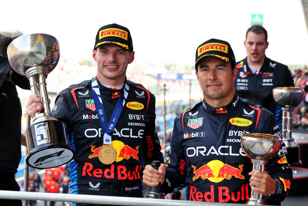 (L to R): Race winner Max Verstappen (NLD) Red Bull Racing celebrates on the podium with second placed team mate Sergio Perez (MEX) Red Bull Racing. 07.04.2024. Formula 1 World Championship, Rd 4, Japanese Grand Prix, Suzuka, Japan, Race Day. - www.xpbimages.com, EMail: requests@xpbimages.com © Copyright: Moy / XPB Images