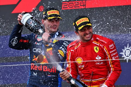 (L to R): Race winner Max Verstappen (NLD) Red Bull Racing celebrates on the podium with third placed Carlos Sainz Jr (ESP) Ferrari.
07.04.2024. Formula 1 World Championship, Rd 4, Japanese Grand Prix, Suzuka, Japan, Race Day.
 - www.xpbimages.com, EMail: requests@xpbimages.com © Copyright: Coates / XPB Images