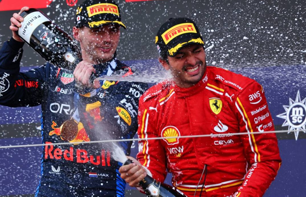 (L to R): Race winner Max Verstappen (NLD) Red Bull Racing celebrates on the podium with third placed Carlos Sainz Jr (ESP) Ferrari. 07.04.2024. Formula 1 World Championship, Rd 4, Japanese Grand Prix, Suzuka, Japan, Race Day. - www.xpbimages.com, EMail: requests@xpbimages.com © Copyright: Coates / XPB Images