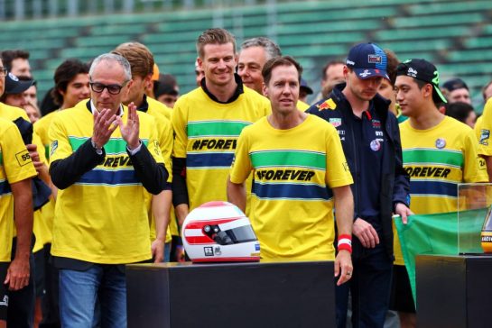 (L to R): Stefano Domenicali (ITA) Formula One President and CEO; Sebastian Vettel (GER) - Drivers and team personnel - tribute run for Ayrton Senna and Roland Ratzenberger.
16.05.2024. Formula 1 World Championship, Rd 7, Emilia Romagna Grand Prix, Imola, Italy, Preparation Day.
- www.xpbimages.com, EMail: requests@xpbimages.com © Copyright: Batchelor / XPB Images