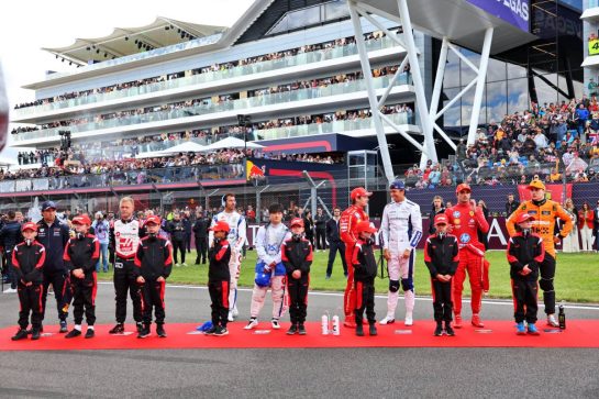 Drivers as the grid observes the national anthem.
07.07.2024. Formula 1 World Championship, Rd 12, British Grand Prix, Silverstone, England, Race Day.
- www.xpbimages.com, EMail: requests@xpbimages.com © Copyright: Batchelor / XPB Images