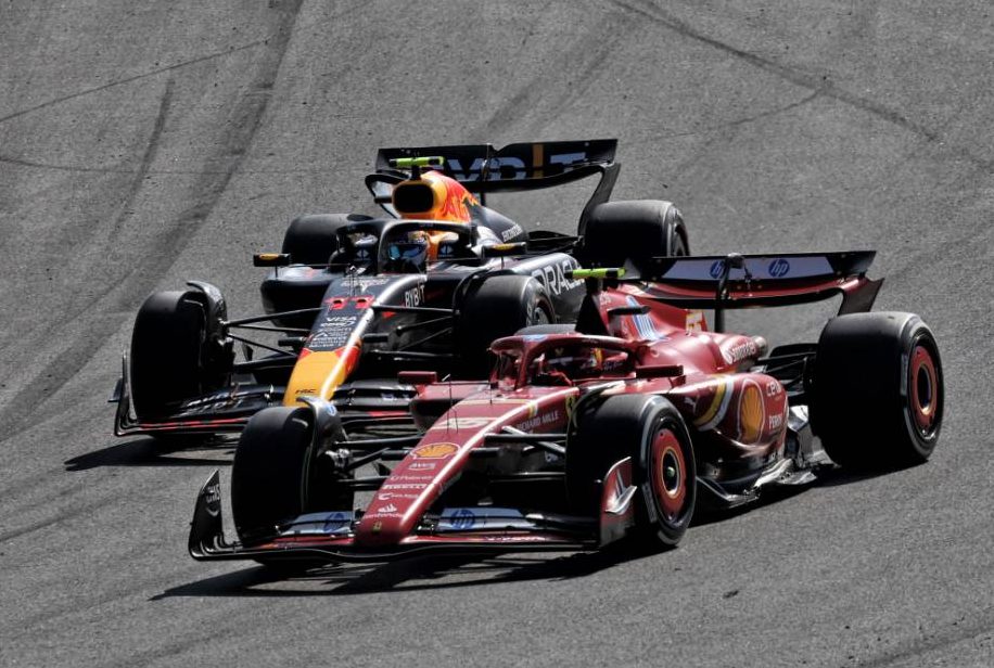 Sergio Perez (MEX) Red Bull Racing RB20 and Carlos Sainz Jr (ESP) Ferrari SF-24 battle it out for the top spot. 25.08.2024. Formula 1 World Championship, Rd 15, Dutch Grand Prix, Zandvoort, Netherlands, Race Day. - www.xpbimages.com, EMail: requests@xpbimages.com © Copyright: Moy / XPB Images