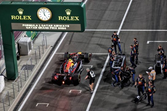 Sergio Perez (MEX) Red Bull Racing RB20 at the pit lane exit.
30.11.2024. Formula 1 World Championship, Rd 23, Qatar Grand Prix, Doha, Qatar, Sprint and Qualifying Day.
- www.xpbimages.com, EMail: requests@xpbimages.com © Copyright: Bearne / XPB Images