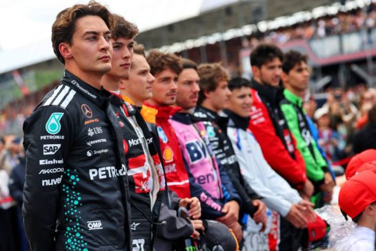 George Russell (GBR) Mercedes AMG F1 as the grid observes the national anthem.
06.07.2025. Formula 1 World Championship, Rd 12, British Grand Prix, Silverstone, England, Race Day.
- www.xpbimages.com, EMail: requests@xpbimages.com © Copyright: Batchelor / XPB Images