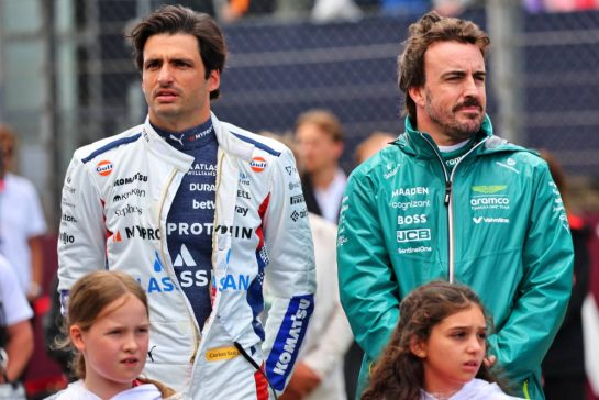 (L to R): Carlos Sainz (ESP) Atlassian Williams Racing and Fernando Alonso (ESP) Aston Martin F1 Team as the grid observes the national anthem.
06.07.2025. Formula 1 World Championship, Rd 12, British Grand Prix, Silverstone, England, Race Day.
- www.xpbimages.com, EMail: requests@xpbimages.com © Copyright: Batchelor / XPB Images