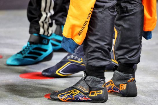 Racing boots of Oscar Piastri (AUS) McLaren; Max Verstappen (NLD) Red Bull Racing; and George Russell (GBR) Mercedes AMG F1, in qualifying parc ferme.
04.10.2025. Formula 1 World Championship, Rd 18, Singapore Grand Prix, Marina Bay Street Circuit, Singapore, Qualifying Day.
- www.xpbimages.com, EMail: requests@xpbimages.com © Copyright: Charniaux / XPB Images