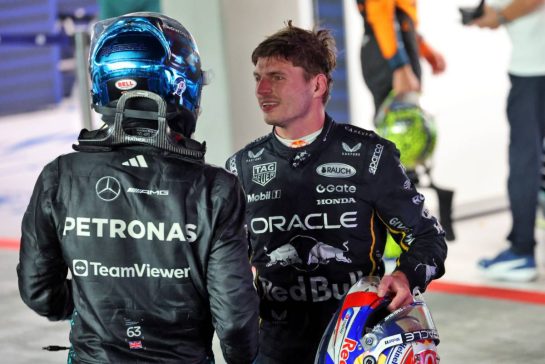(L to R): Race winner George Russell (GBR) Mercedes AMG F1 celebrates in parc ferme with second placed Max Verstappen (NLD) Red Bull Racing.
05.10.2025. Formula 1 World Championship, Rd 18, Singapore Grand Prix, Marina Bay Street Circuit, Singapore, Race Day.
- www.xpbimages.com, EMail: requests@xpbimages.com © Copyright: Batchelor / XPB Images