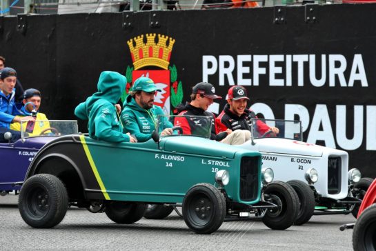(L to R): Lance Stroll (CDN) Aston Martin F1 Team; Fernando Alonso (ESP) Aston Martin F1 Team; Oliver Bearman (GBR) Haas F1 Team; and Esteban Ocon (FRA) Haas F1 Team, on the drivers' parade.
09.11.2025. Formula 1 World Championship, Rd 21, Brazilian Grand Prix, Sao Paulo, Brazil, Race Day.
- www.xpbimages.com, EMail: requests@xpbimages.com © Copyright: Batchelor / XPB Images