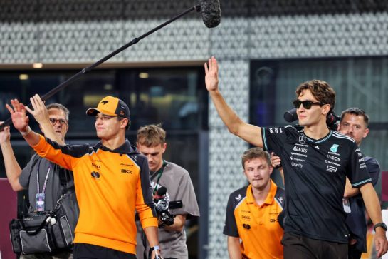 (L to R): Lando Norris (GBR) McLaren and George Russell (GBR) Mercedes AMG F1 on the drivers' parade.
30.11.2025. Formula 1 World Championship, Rd 23, Qatar Grand Prix, Doha, Qatar, Race Day.
- www.xpbimages.com, EMail: requests@xpbimages.com © Copyright: Charniaux / XPB Images