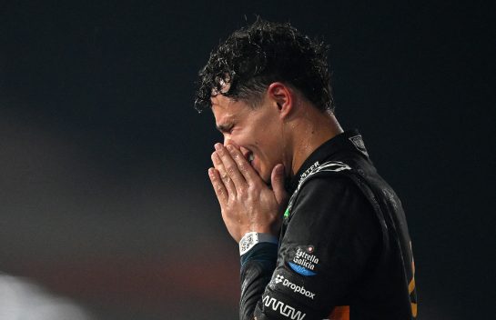 ABU DHABI, UNITED ARAB EMIRATES - DECEMBER 07: 2025 F1 World Drivers Champion and Third placed Lando Norris of Great Britain and McLaren celebrates on the podium during the F1 Grand Prix of Abu Dhabi at Yas Marina Circuit on December 07, 2025 in Abu Dhabi, United Arab Emirates. (Photo by Clive Mason/Getty Images)