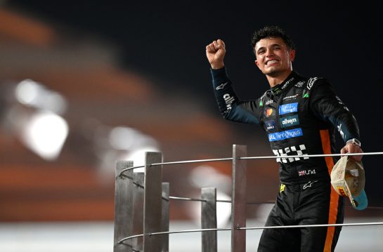 ABU DHABI, UNITED ARAB EMIRATES - DECEMBER 07: 2025 F1 World Drivers Champion and Third placed Lando Norris of Great Britain and McLaren celebrates on the podium during the F1 Grand Prix of Abu Dhabi at Yas Marina Circuit on December 07, 2025 in Abu Dhabi, United Arab Emirates. (Photo by Clive Mason/Getty Images)