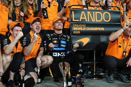 ABU DHABI, UNITED ARAB EMIRATES - DECEMBER 07: 2025 F1 World Drivers Champion Lando Norris of Great Britain and McLaren celebrates with his team during the F1 Grand Prix of Abu Dhabi at Yas Marina Circuit on December 07, 2025 in Abu Dhabi, United Arab Emirates. (Photo by Sam Bagnall/Sutton Images)