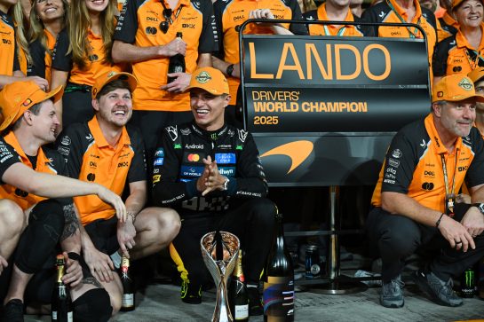 ABU DHABI, UNITED ARAB EMIRATES - DECEMBER 07: 2025 F1 World Drivers Champion Lando Norris of Great Britain and McLaren celebrates with his team during the F1 Grand Prix of Abu Dhabi at Yas Marina Circuit on December 07, 2025 in Abu Dhabi, United Arab Emirates. (Photo by Sam Bagnall/Sutton Images)