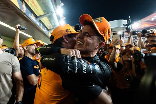 ABU DHABI, UNITED ARAB EMIRATES - DECEMBER 07: 2025 F1 World Drivers Champion Lando Norris of Great Britain and McLaren celebrates with his team during the F1 Grand Prix of Abu Dhabi at Yas Marina Circuit on December 07, 2025 in Abu Dhabi, United Arab Emirates. (Photo by Andrew Ferraro/LAT Images)