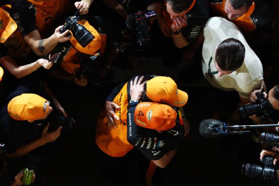 ABU DHABI, UNITED ARAB EMIRATES - DECEMBER 07: 2025 F1 World Drivers Champion Lando Norris of Great Britain and McLaren celebrates with his team during the F1 Grand Prix of Abu Dhabi at Yas Marina Circuit on December 07, 2025 in Abu Dhabi, United Arab Emirates. (Photo by Peter Fox/Getty Images)