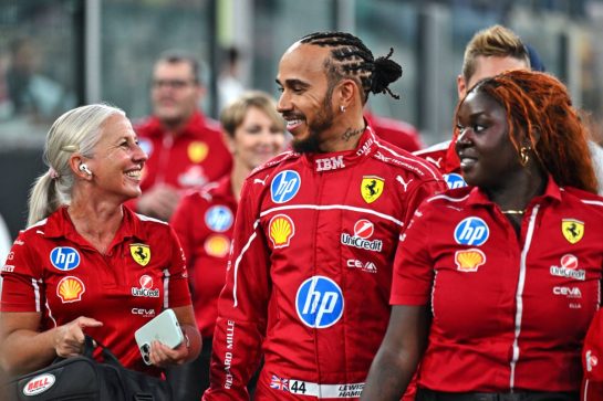 (L to R): Angela Cullen (NZL) Ferrari Physiotherapist with Lewis Hamilton (GBR) Ferrari and Ella (ITA) Ferrari Press Officer.
04.12.2025. Formula 1 World Championship, Rd 24, Abu Dhabi Grand Prix, Yas Marina Circuit, Abu Dhabi, Preparation Day.
- www.xpbimages.com, EMail: requests@xpbimages.com © Copyright: Price	/ XPB Images